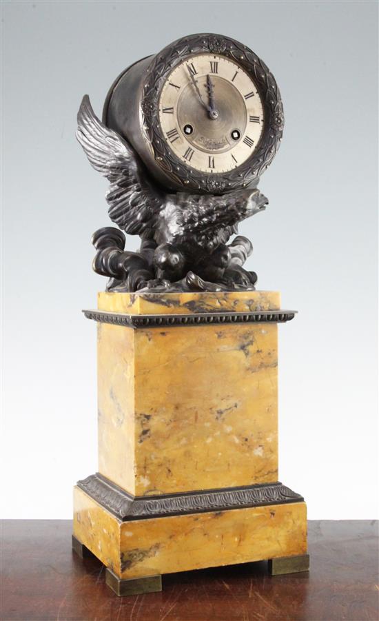 A 19th century French Empire style bronze and marble mantel clock, 17.75in.